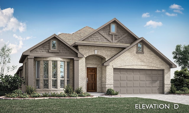 view of front of home with a garage and a front lawn