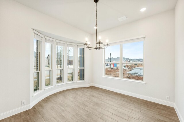 kitchen featuring a healthy amount of sunlight, white cabinetry, and stainless steel dishwasher