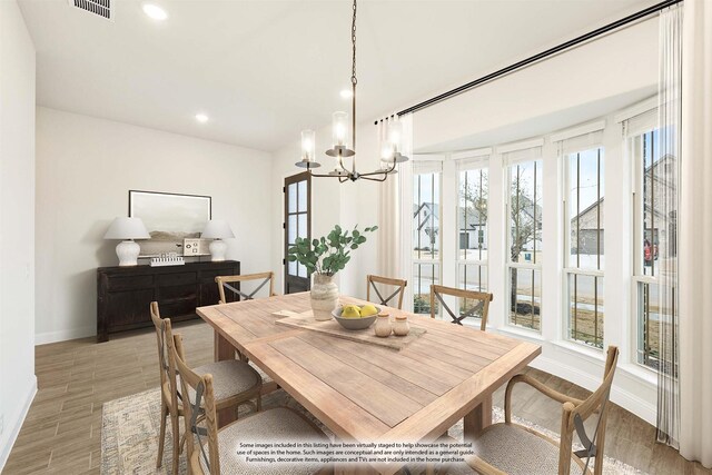 kitchen with light hardwood / wood-style flooring, sink, stainless steel appliances, white cabinets, and premium range hood