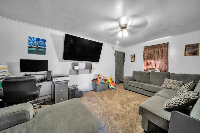 living room featuring crown molding, carpet, and ceiling fan