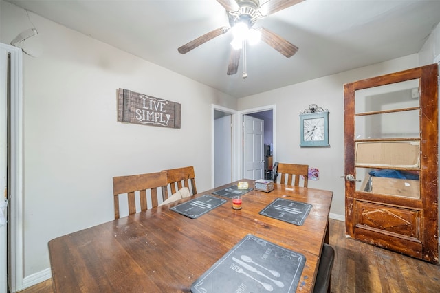 dining area with ceiling fan and hardwood / wood-style floors