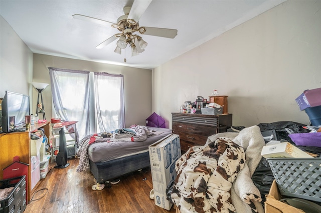 bedroom featuring ceiling fan and dark wood-type flooring