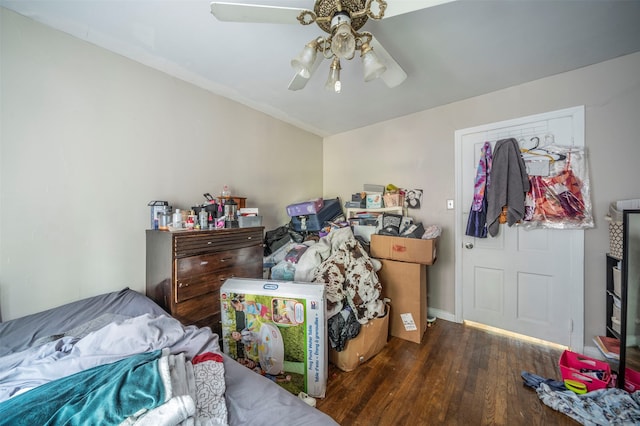 bedroom with ceiling fan and dark wood-type flooring