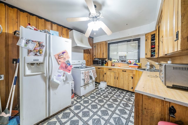 kitchen featuring ceiling fan, premium range hood, white appliances, and sink