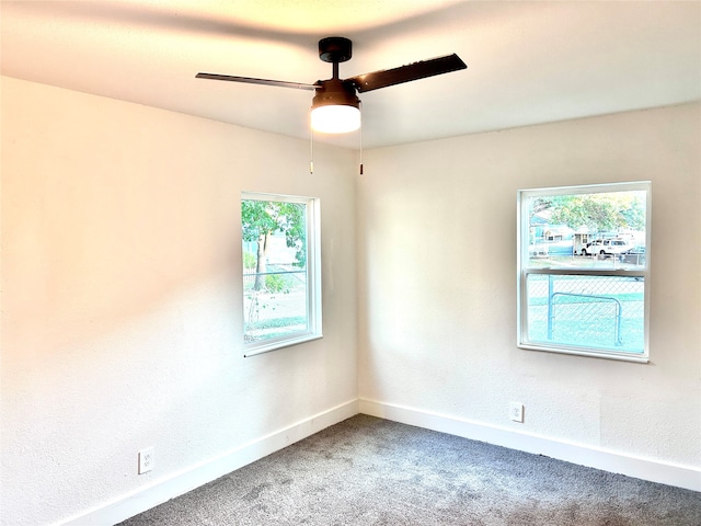 carpeted empty room with ceiling fan