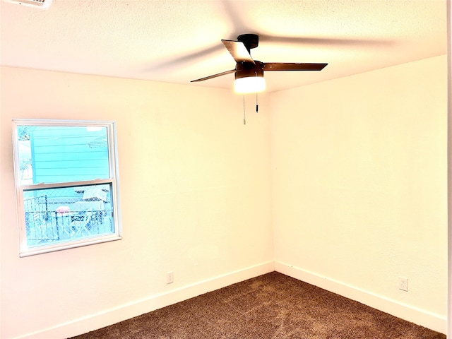 unfurnished room with ceiling fan, a textured ceiling, and carpet floors