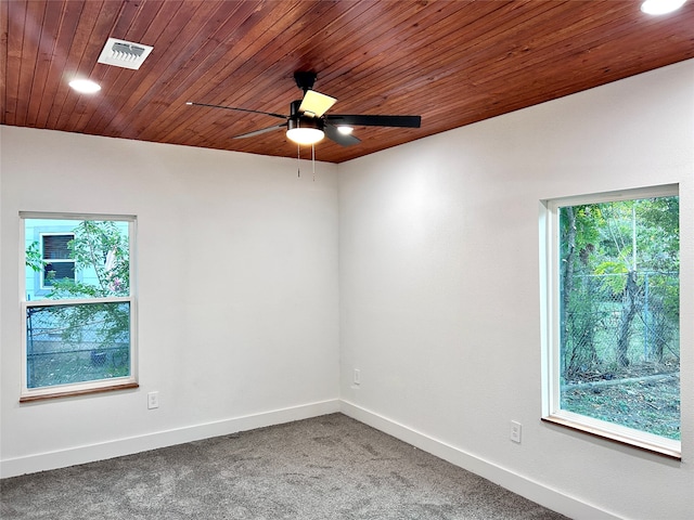 unfurnished room with wooden ceiling, ceiling fan, and carpet floors