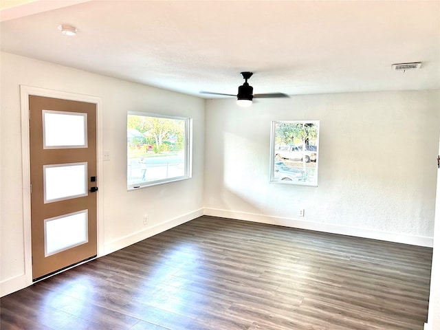 interior space featuring ceiling fan and dark hardwood / wood-style floors