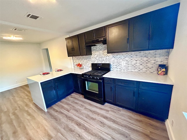 kitchen featuring tasteful backsplash, kitchen peninsula, black gas range, and light hardwood / wood-style floors