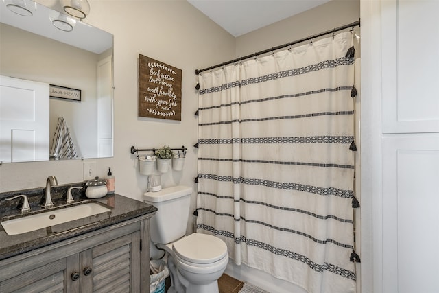 full bathroom featuring curtained shower, toilet, and vanity