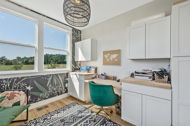 office with light hardwood / wood-style floors