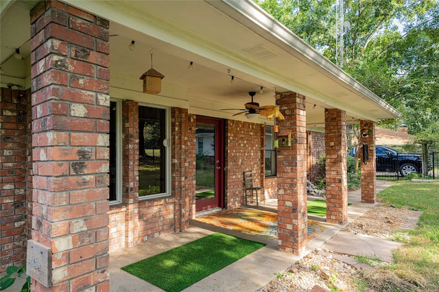 doorway to property featuring ceiling fan