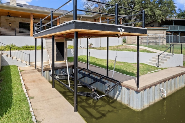 dock area with a water view