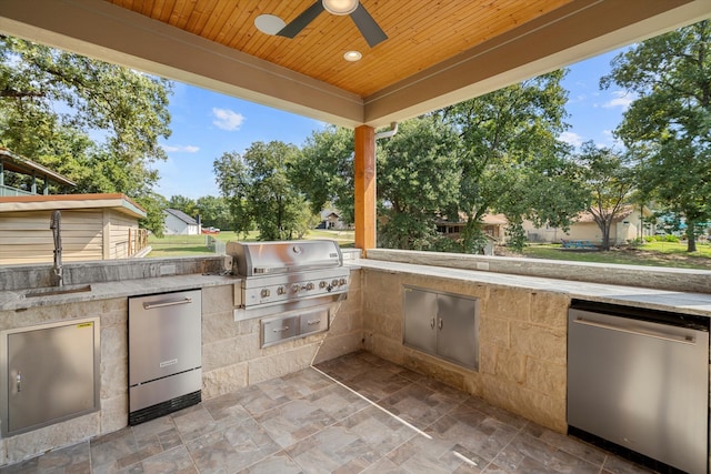 view of patio featuring sink, area for grilling, and ceiling fan