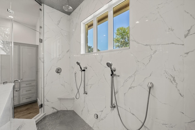 bathroom with a shower with shower door