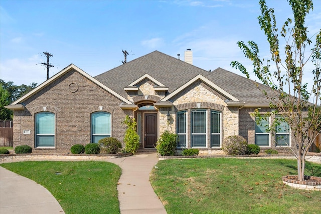 french country style house featuring a front lawn