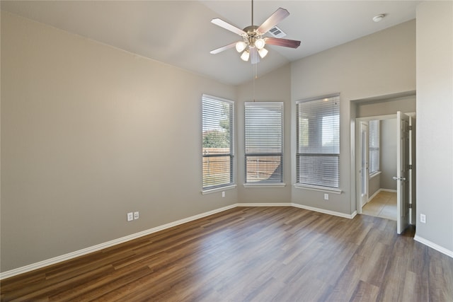 unfurnished room featuring lofted ceiling, ceiling fan, and hardwood / wood-style floors