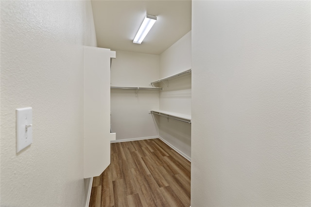 walk in closet featuring light hardwood / wood-style floors