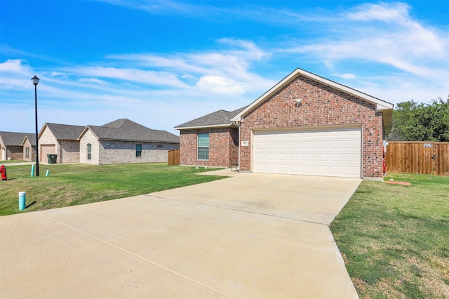 view of front of property with a garage and a front lawn