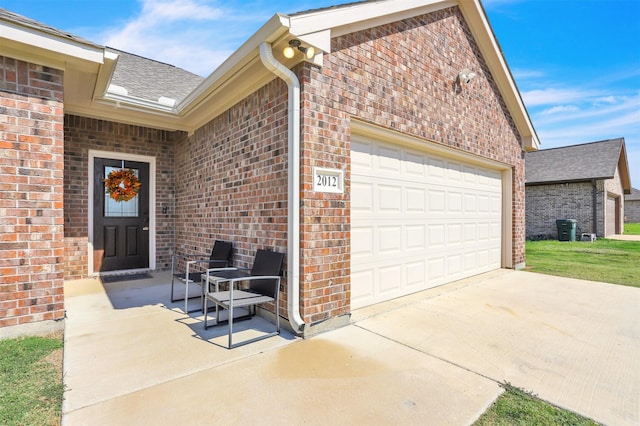 entrance to property featuring a garage