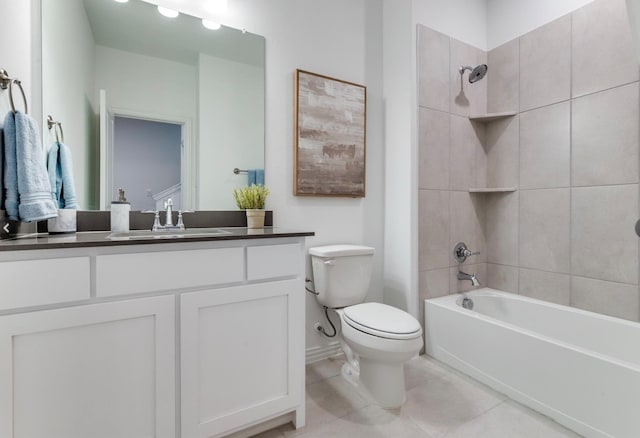 full bathroom featuring tiled shower / bath combo, tile patterned floors, vanity, and toilet