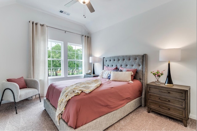 carpeted bedroom with vaulted ceiling and ceiling fan