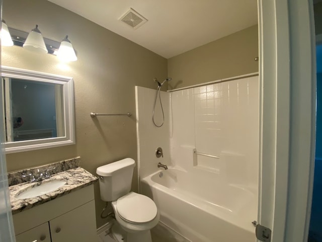 full bathroom featuring tub / shower combination, toilet, and vanity