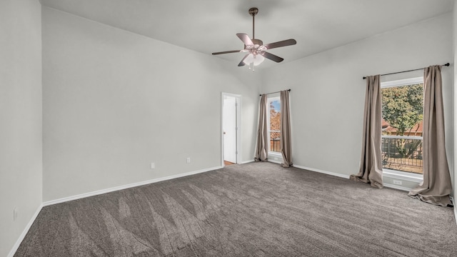 carpeted spare room featuring baseboards and ceiling fan