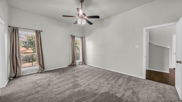 unfurnished room with baseboards, a ceiling fan, and carpet