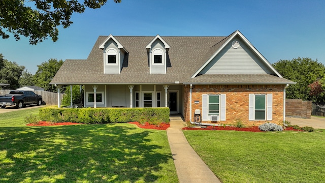 view of front of home featuring a porch and a front yard