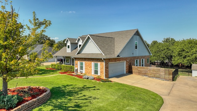 view of front facade with a front yard and a garage