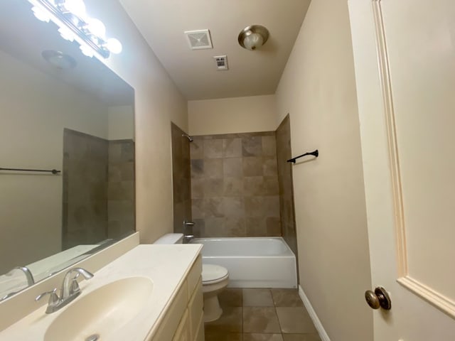 full bathroom with tiled shower / bath, vanity, tile patterned flooring, and toilet