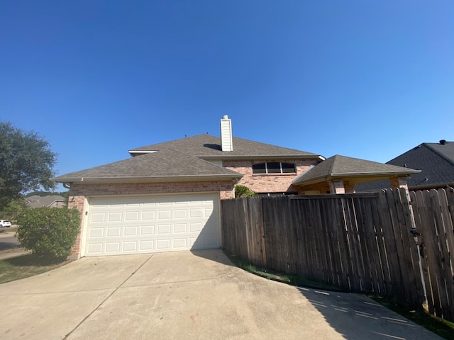 view of side of home featuring a garage