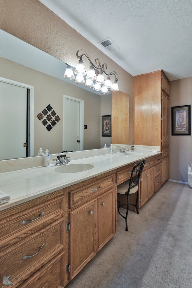 bathroom with vanity and a textured ceiling