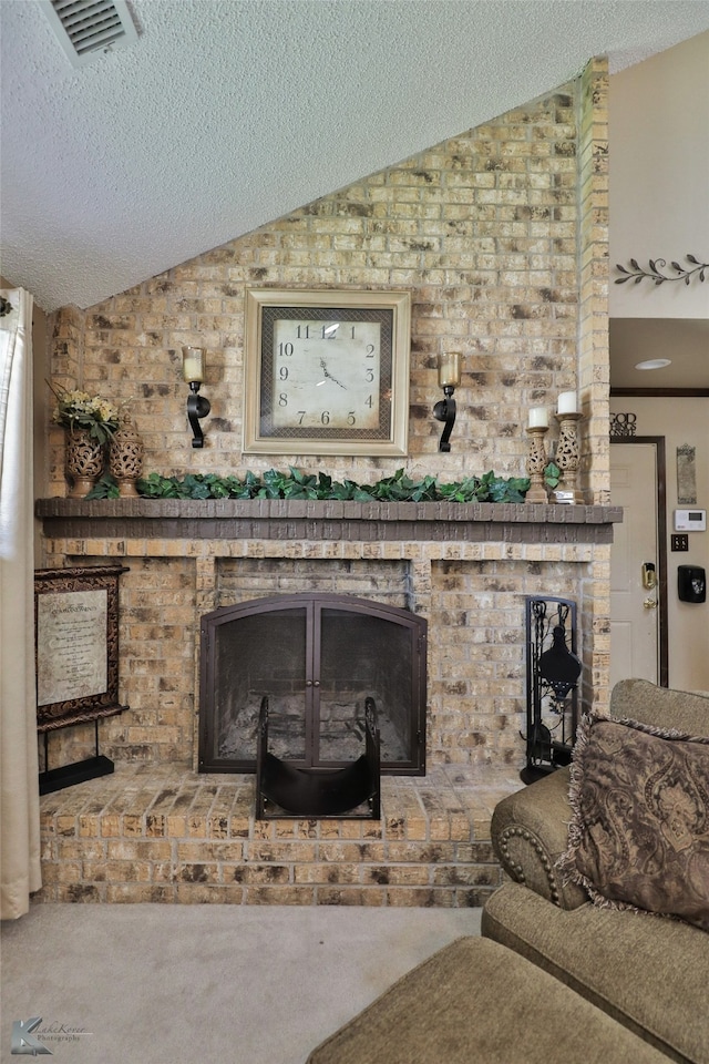 carpeted living room featuring lofted ceiling, a fireplace, and a textured ceiling