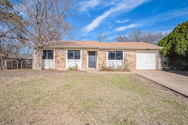 single story home with a front yard and a garage