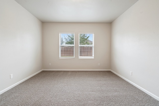 unfurnished room featuring carpet floors