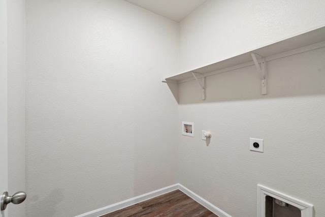 laundry area featuring dark wood-type flooring, hookup for a washing machine, and electric dryer hookup