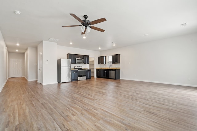 unfurnished living room with ceiling fan and light hardwood / wood-style flooring