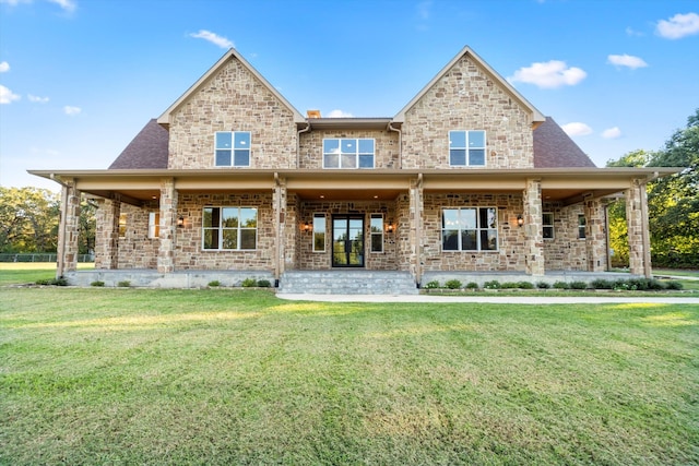 rear view of house with a yard