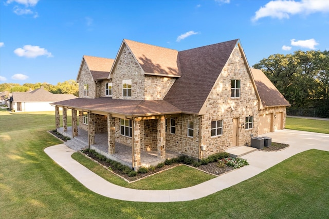 view of property exterior featuring a yard, a garage, cooling unit, and a patio