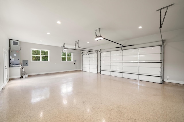 garage with a garage door opener and heating unit