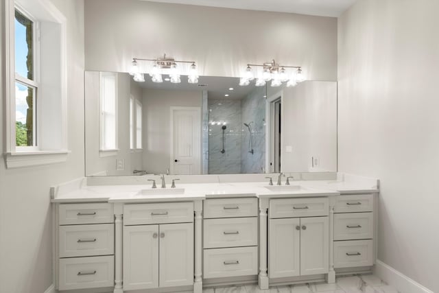 bathroom with a shower with door and vanity