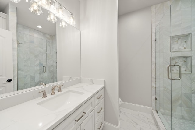 bathroom featuring toilet, walk in shower, and vanity