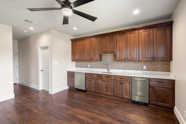 kitchen with stainless steel dishwasher, dark wood-type flooring, ceiling fan, and tasteful backsplash