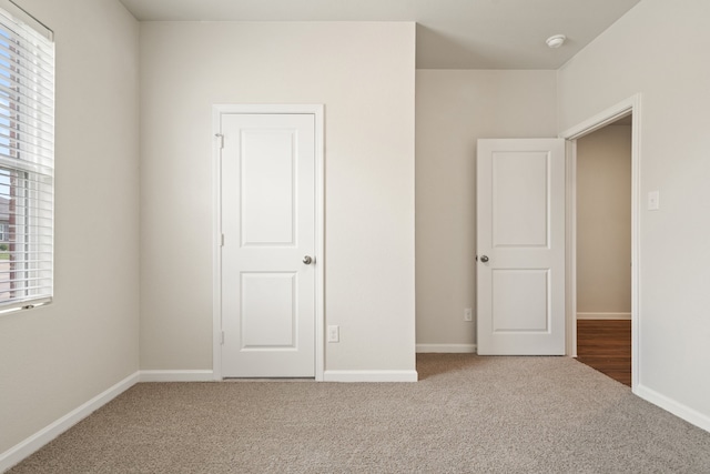 unfurnished bedroom with carpet