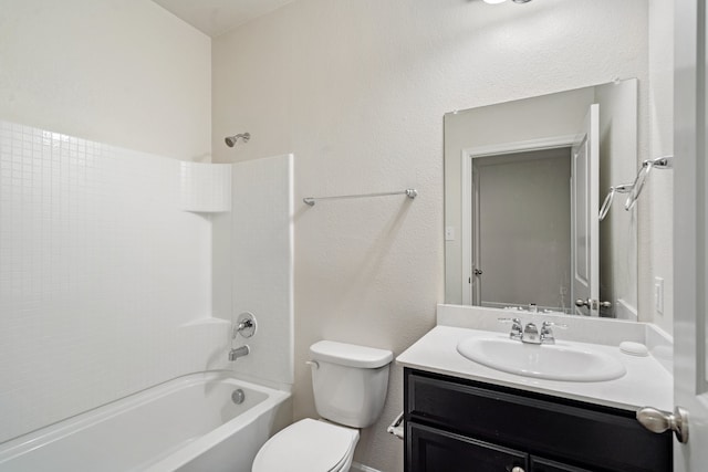 full bathroom featuring tub / shower combination, vanity, and toilet