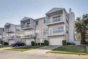 view of property with a garage and a balcony