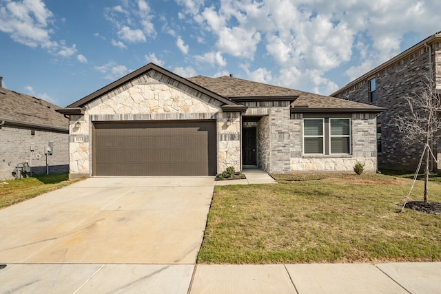 view of front of house featuring a front yard and a garage