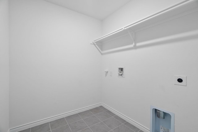 washroom with hookup for an electric dryer, hookup for a gas dryer, tile patterned floors, and washer hookup